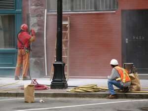Workers sandblasting at Gastown in Vancouver, B.C.